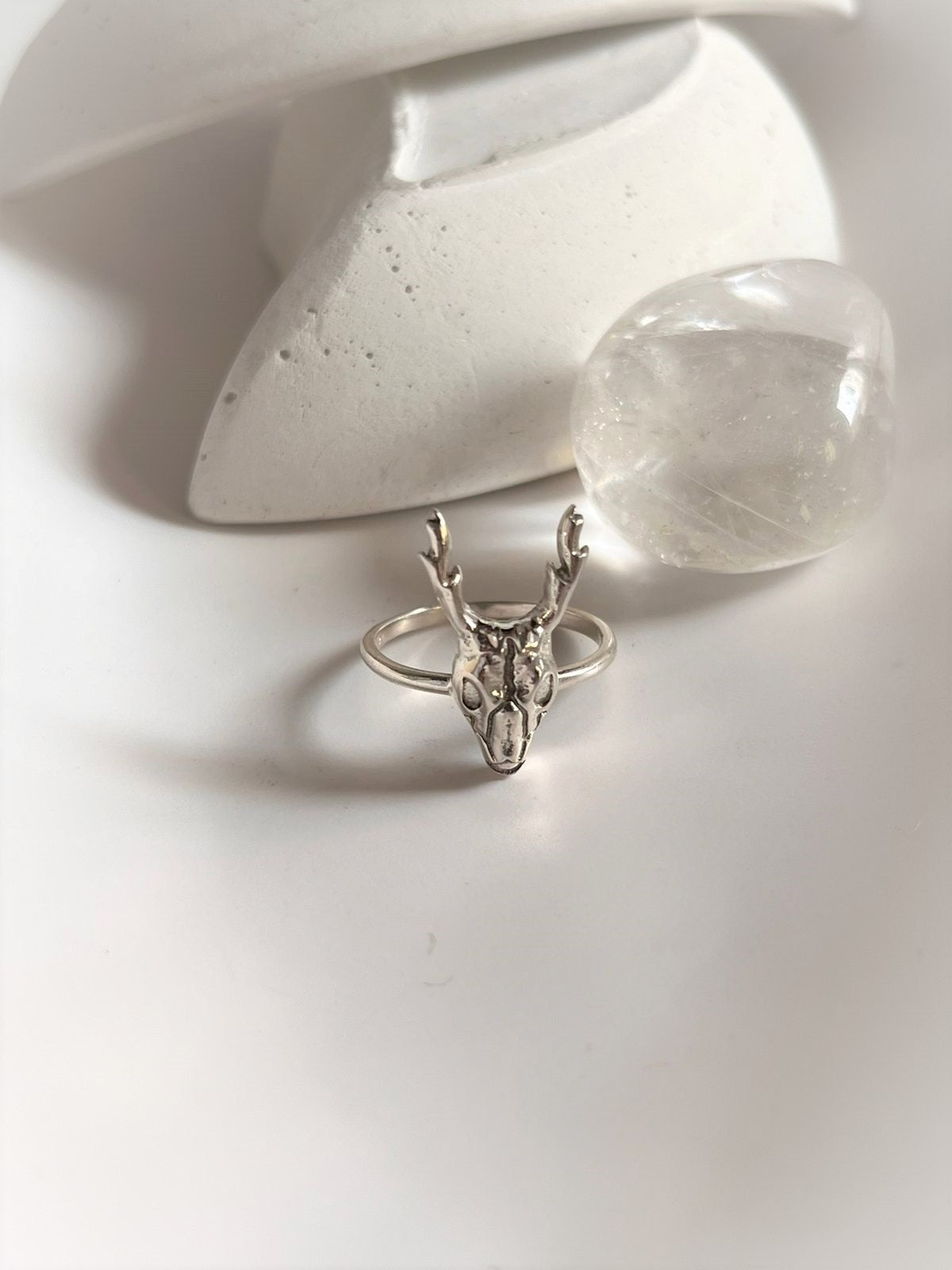 Sleek and edgy deer skull silver ring with a polished finish