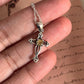 Elegant citrine gemstone set in a vintage cross-shaped silver pendant