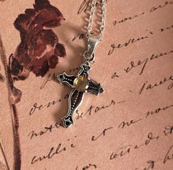 Stylish vintage silver pendant featuring a citrine cross centerpiece