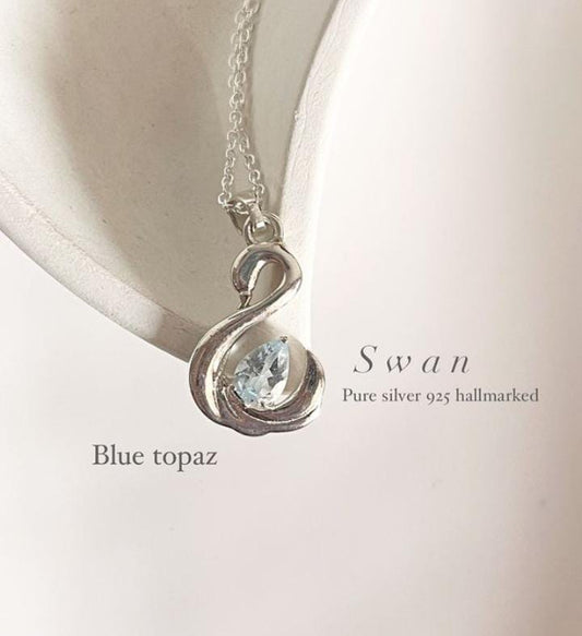 Chic Blue Topaz Swan Pendant in Silver