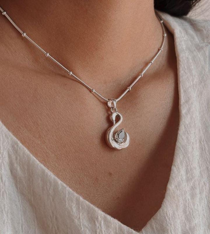 Sophisticated Blue Topaz Swan Pendant Set in Silver