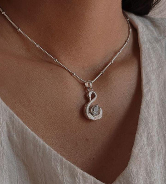 Luxury Blue Topaz Swan Pendant with Silver Detailing