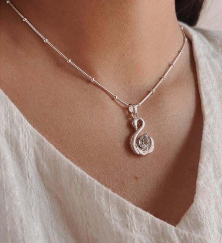 Elegant Blue Topaz Silver Pendant with Swan Design