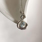 Delicate Blue Topaz Silver Pendant Featuring Swan Design