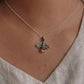 Elegant silver pendant featuring a bee motif and citrine gemstone.