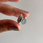 Elegant aqua chalcedony silver ring with a feather-inspired adjustable band.