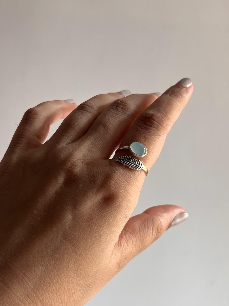 Timeless silver ring with a feather detail and aqua chalcedony, adjustable fit.