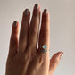 Boho-inspired adjustable silver ring with aqua chalcedony and feather design.