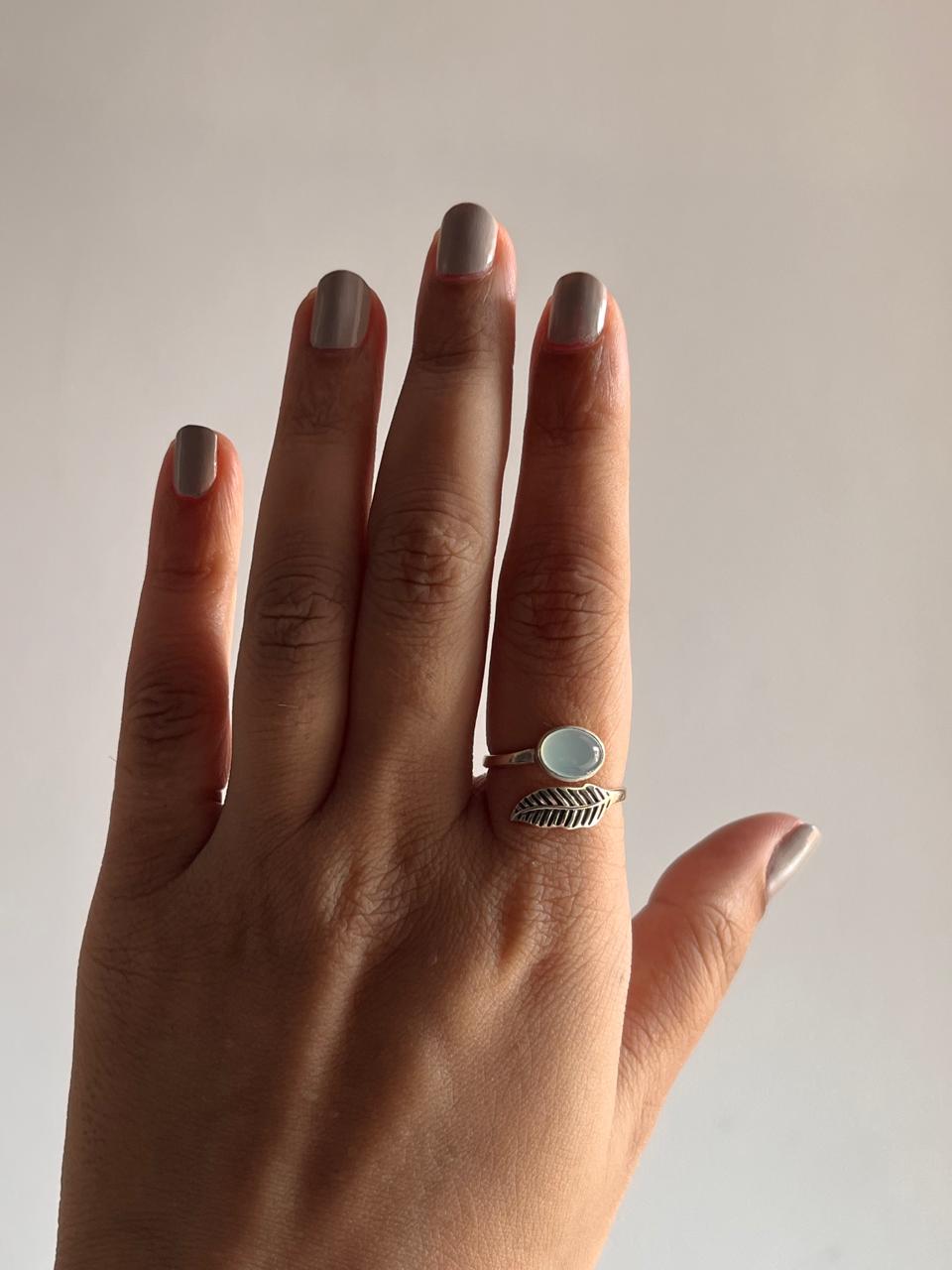 Boho-inspired adjustable silver ring with aqua chalcedony and feather design.