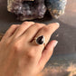 Large silver ring with a pear-cut garnet gemstone