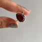 Bold garnet pear-shaped silver ring with a plain design