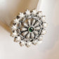 Intricate mandala-style statement ring in silver 925 with a green flower accent.