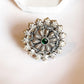 Handcrafted antique silver 925 ring featuring a green flower mandala pattern.