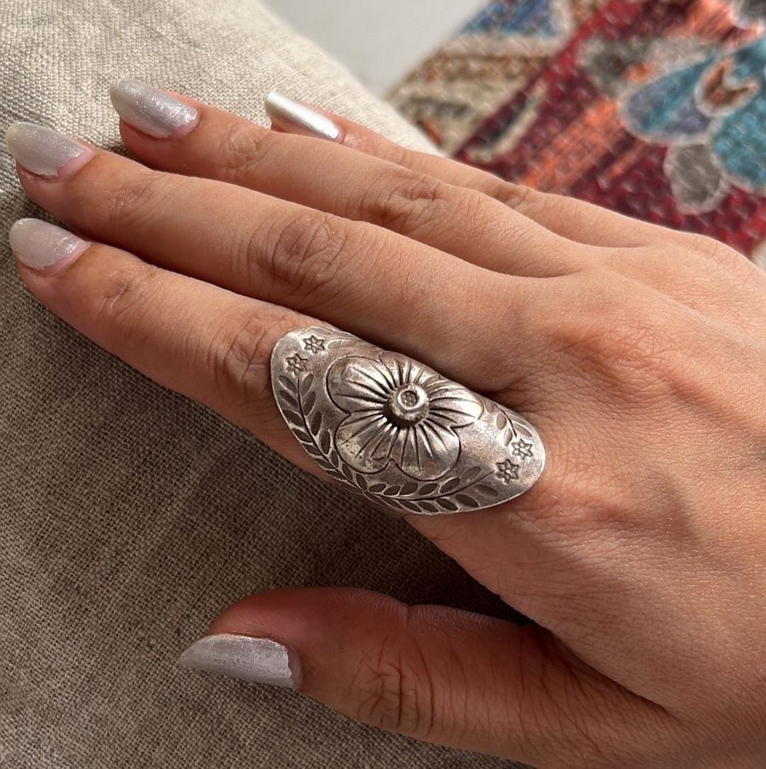 Bohemian-style handcrafted silver ring with an antique mandala flower motif.