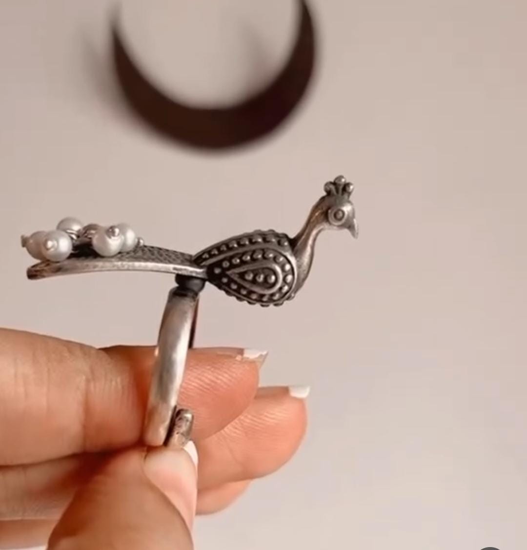 Elegant adjustable silver 925 ring featuring a peacock and freshwater pearl accent.