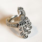 Elegant statement ring in sterling silver 925 featuring a peacock filigree pattern.