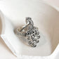 Handcrafted antique silver ring with intricate filigree and peacock design.