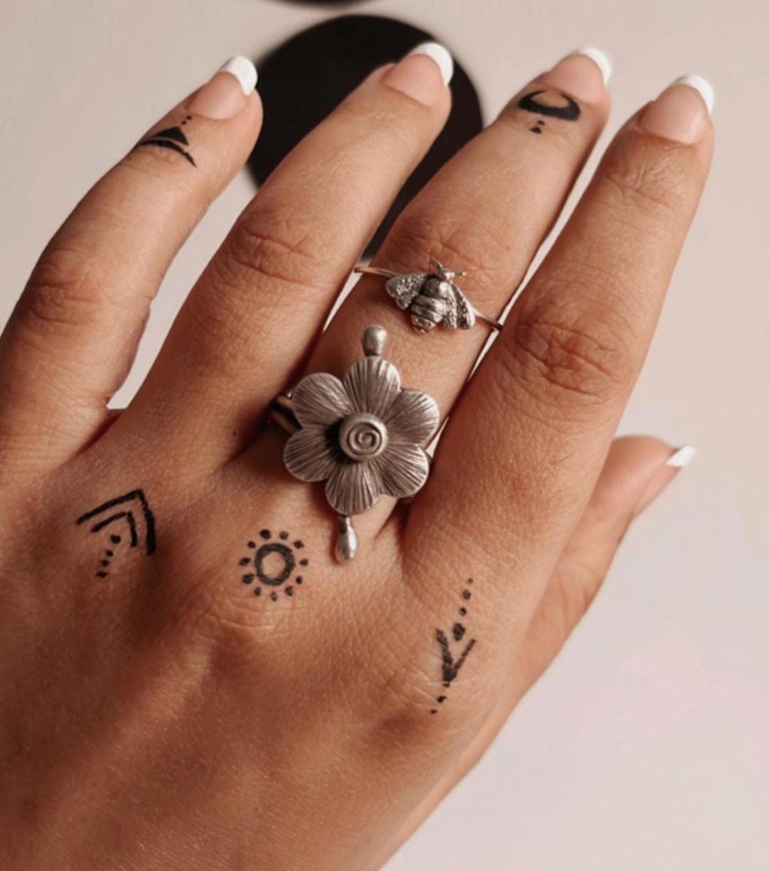 Bohemian-style adjustable silver ring with an antique flower design.