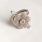 Unique handcrafted adjustable silver ring with a bohemian flower design.