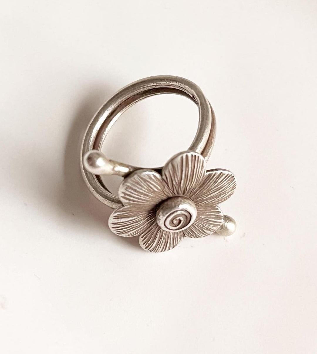 Handcrafted boho flower design ring in antique-style sterling silver.