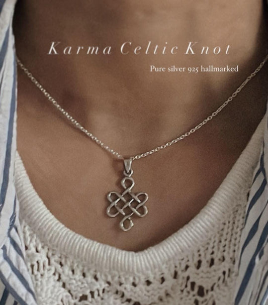 Bold big karma Celtic knot silver pendant with intricate design.