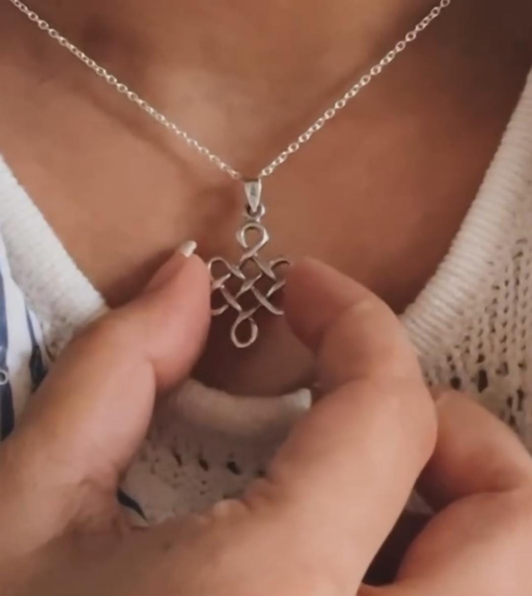 Handcrafted big karma silver pendant featuring a Celtic knot design.