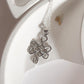 Unique big karma Celtic knot silver pendant for a spiritual statement.