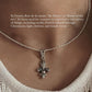 Intricate Fleur De Lis silver pendant with delicate curves and flourishes