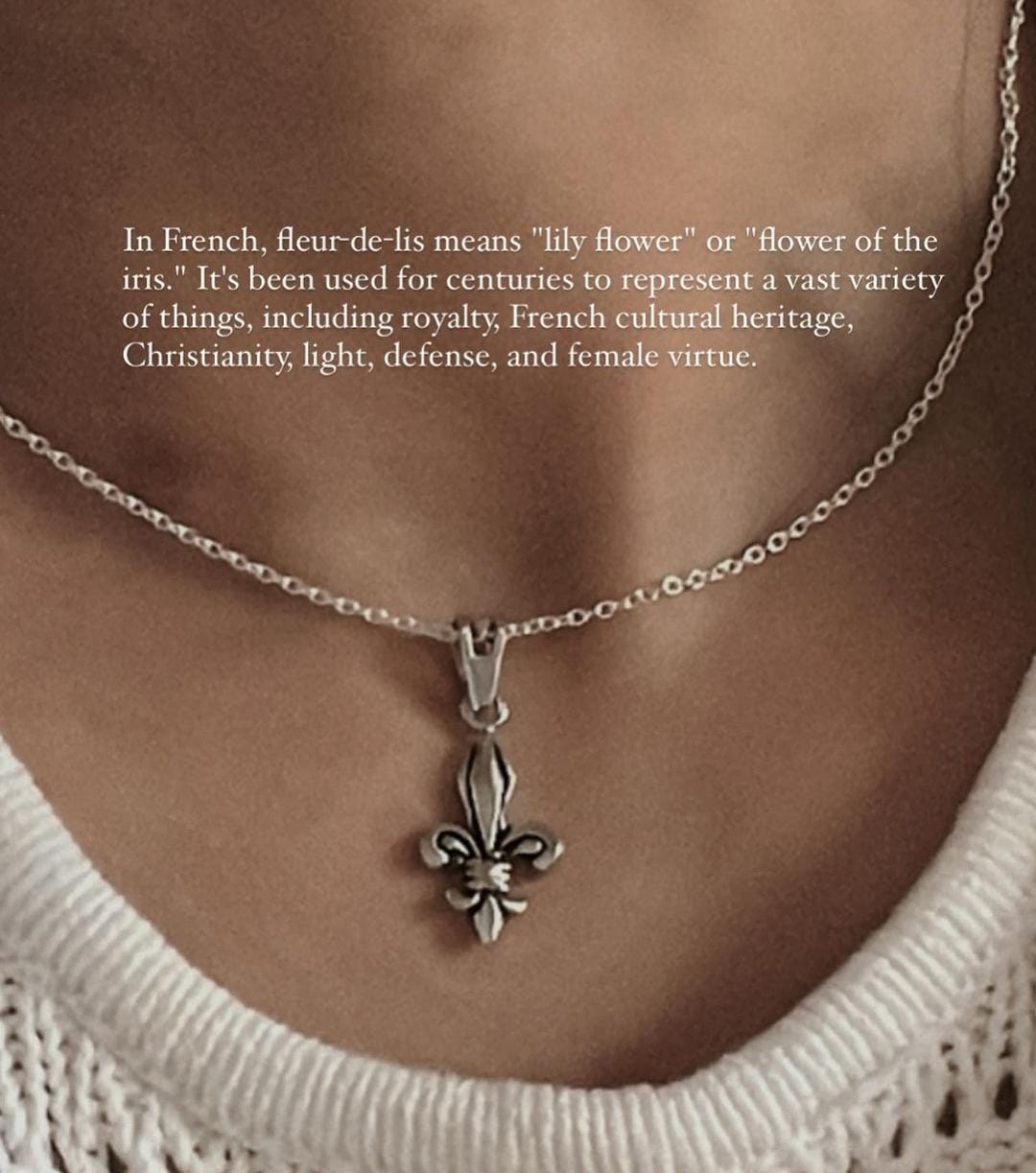 Intricate Fleur De Lis silver pendant with delicate curves and flourishes