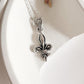 Elegant Fleur De Lis silver pendant with intricate detailing