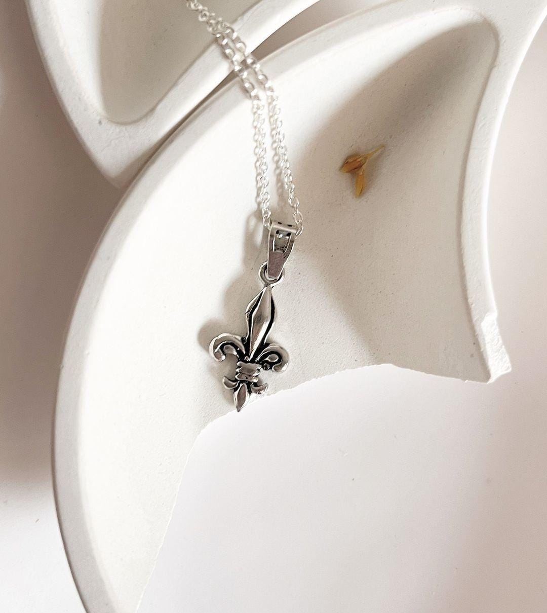 Stylish Fleur De Lis silver pendant perfect for adding a touch of elegance