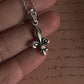 Charming Fleur De Lis silver pendant with a polished, shiny finish