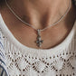 Handcrafted Fleur De Lis silver pendant with a smooth, refined finish