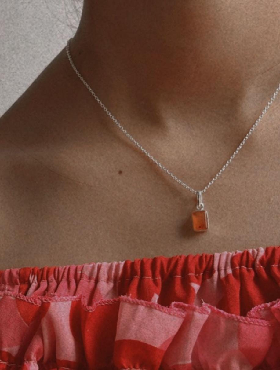 Elegant carnelian rectangle pendant with polished silver frame