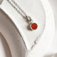 Elegant round carnelian pendant with polished silver setting