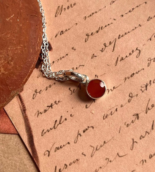 Stylish carnelian round gemstone on a silver pendant necklace