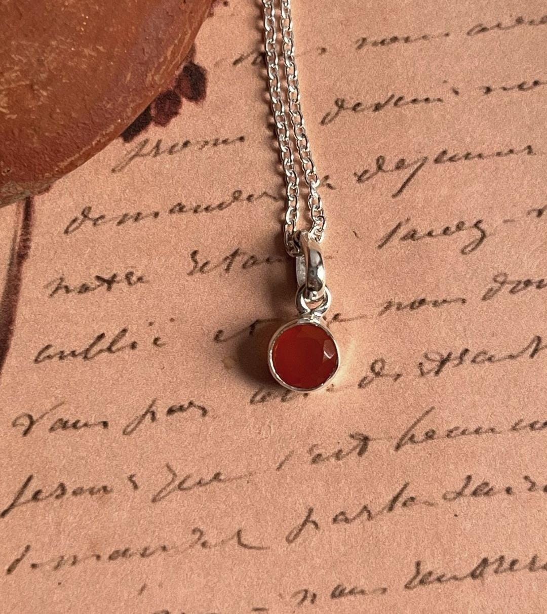 Carnelian round pendant with a delicate silver border