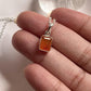 Rectangular carnelian stone showcased in a silver pendant design