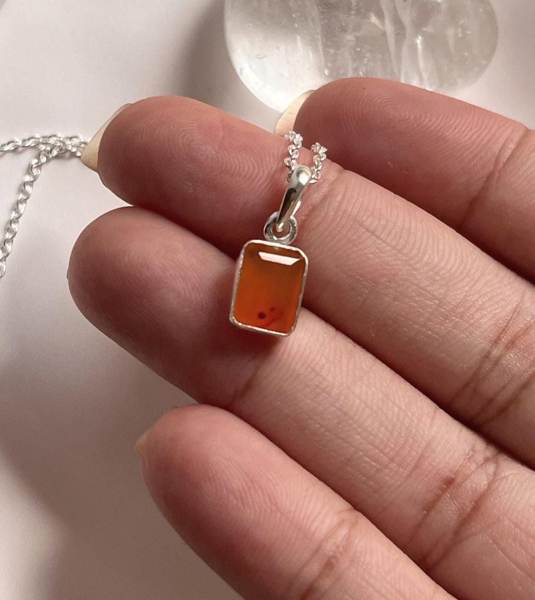 Rectangular carnelian stone showcased in a silver pendant design
