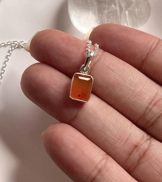 Rectangular carnelian stone showcased in a silver pendant design