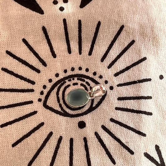 Timeless silver pendant featuring an oval-cut aqua chalcedony gemstone.