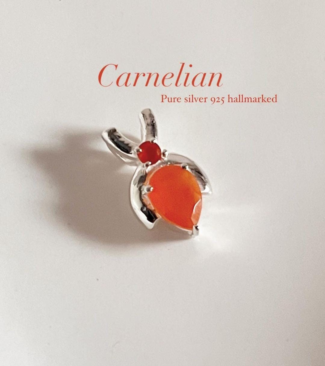 Carnelian pear-shaped pendant on a delicate chain necklace
