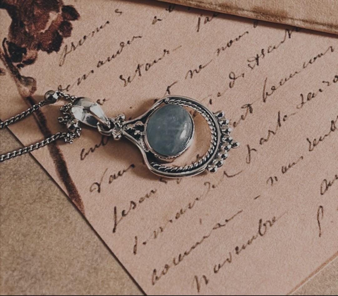 Exquisite aquamarine stone set in a boho-style silver pendant.