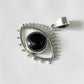 Exquisite black onyx pendant featuring an evil eye design in silver.