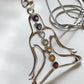 Timeless silver pendant with seven chakra gemstones