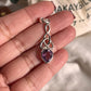 Elegant amethyst trinity knot pendant in sterling silver.