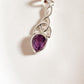 Sterling silver pendant with amethyst stone and trinity knot detail.