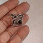 Garnet heart vintage storage pendant with intricate silver detailing