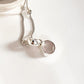 Handcrafted rose quartz round cut pendant in polished silver