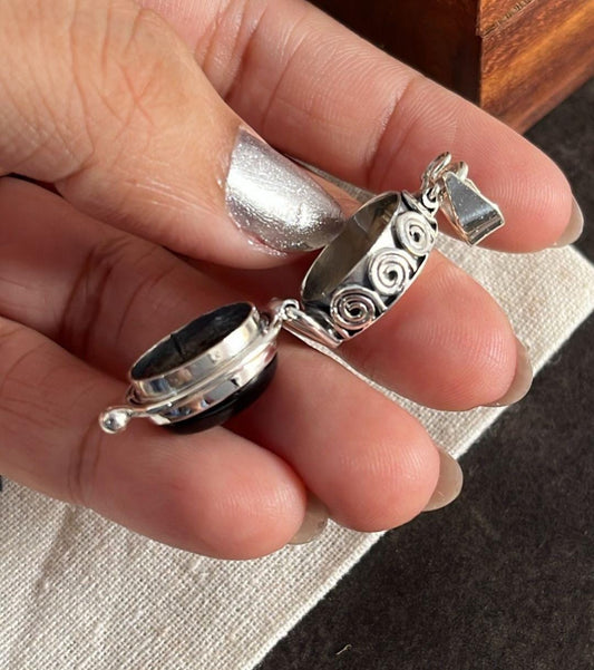 Silver Pendant with Oval Black Onyx Storage Design